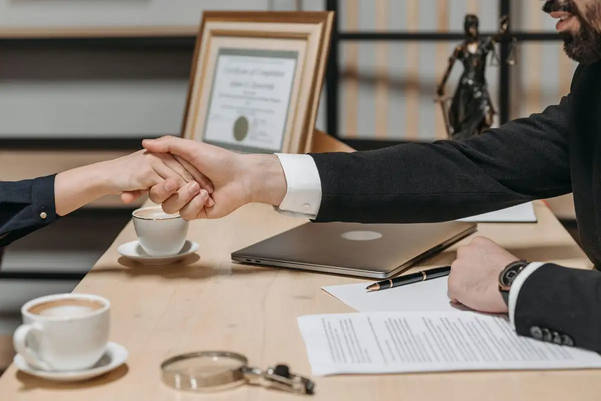 Image of Man Shaking Hand of Client
